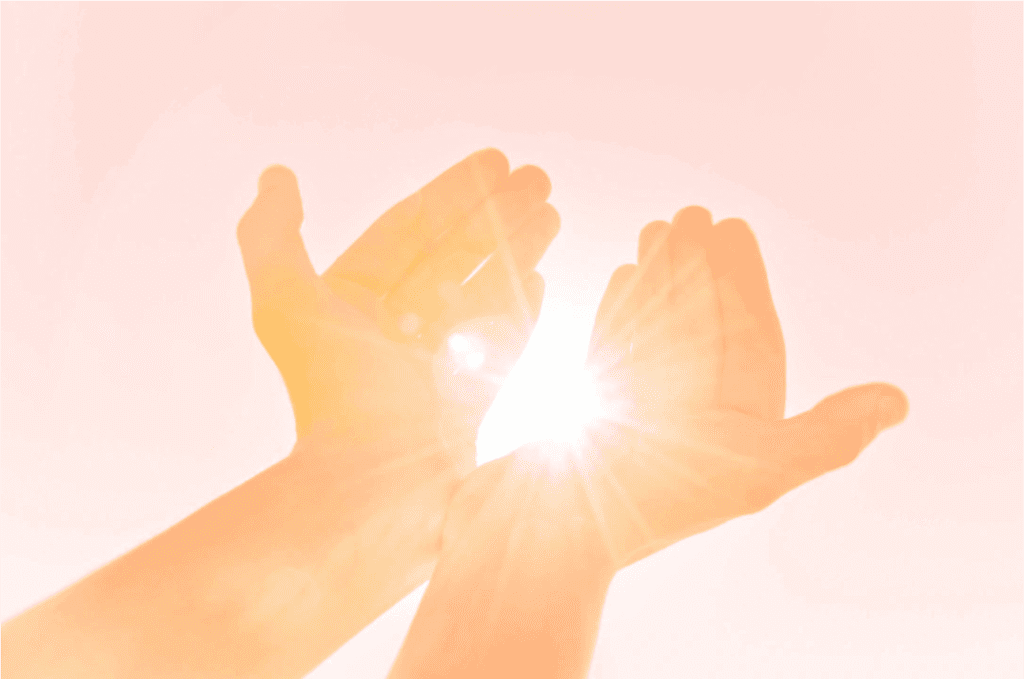 A person is holding their hands up in the air