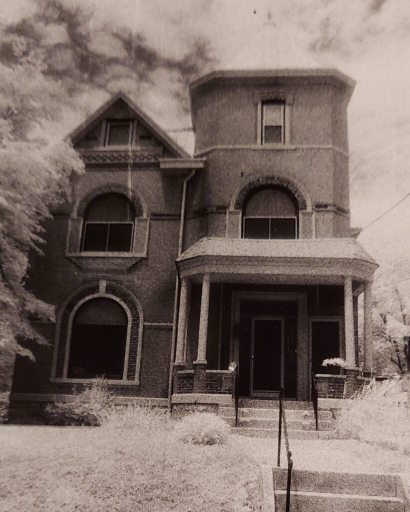 Old brick mansion with stone front steps